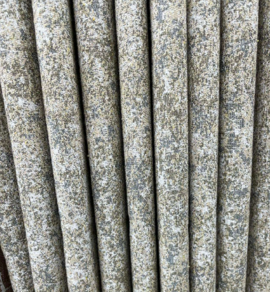 Close-up of grey and beige textured blackout curtain fabric