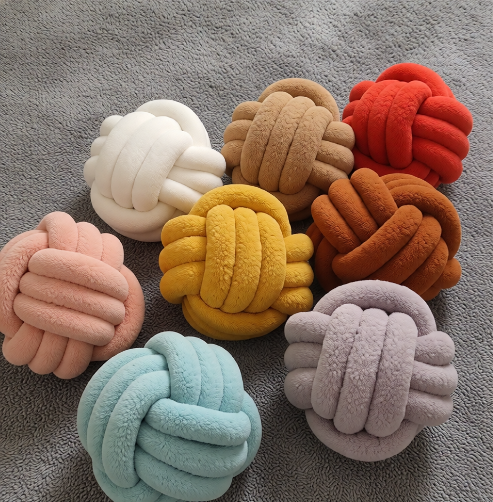 Infinity knot throw pillows in multiple colours