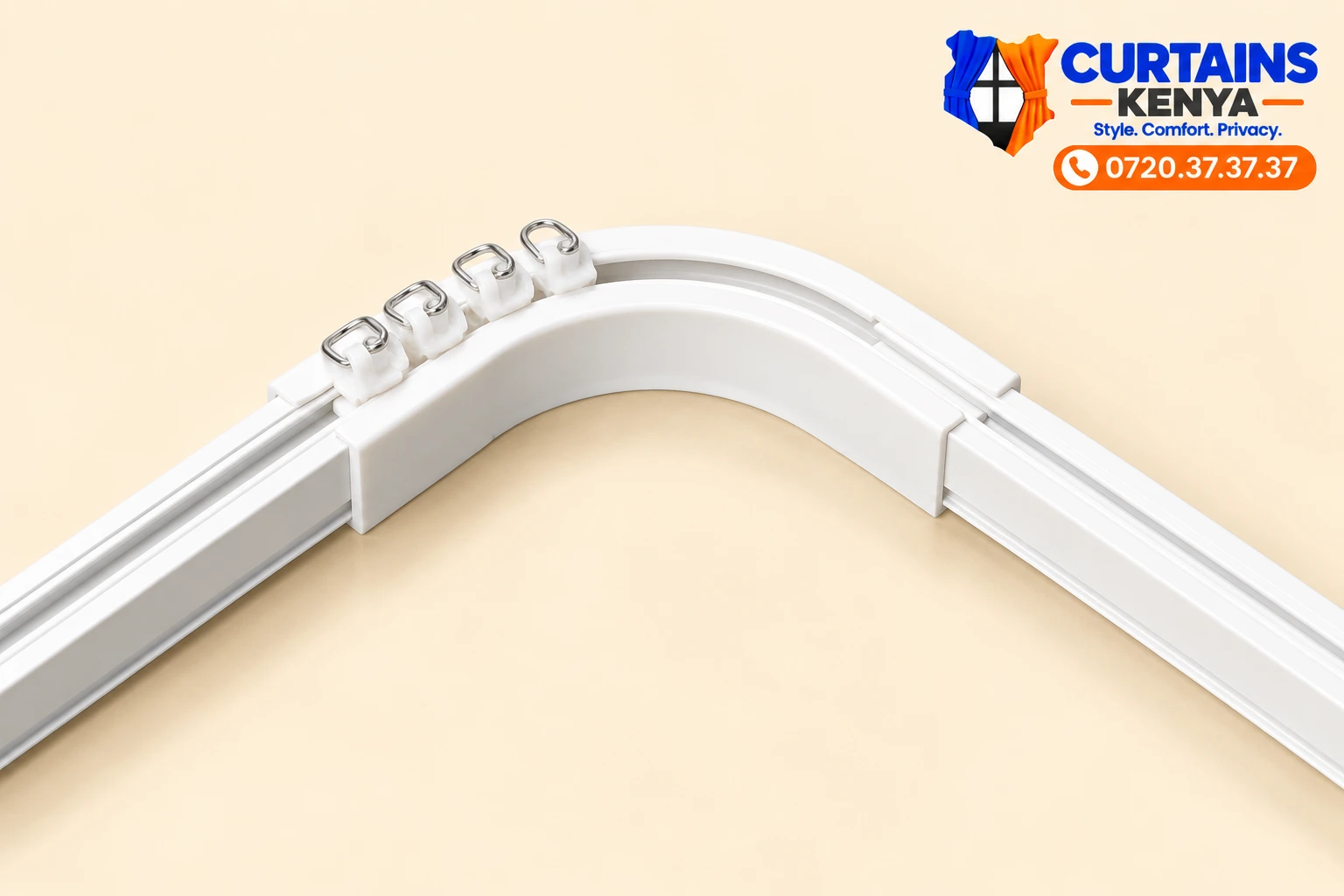 White single curtain rail bend joining straight track sections around a corner, shown with curtain gliders and metal loops.