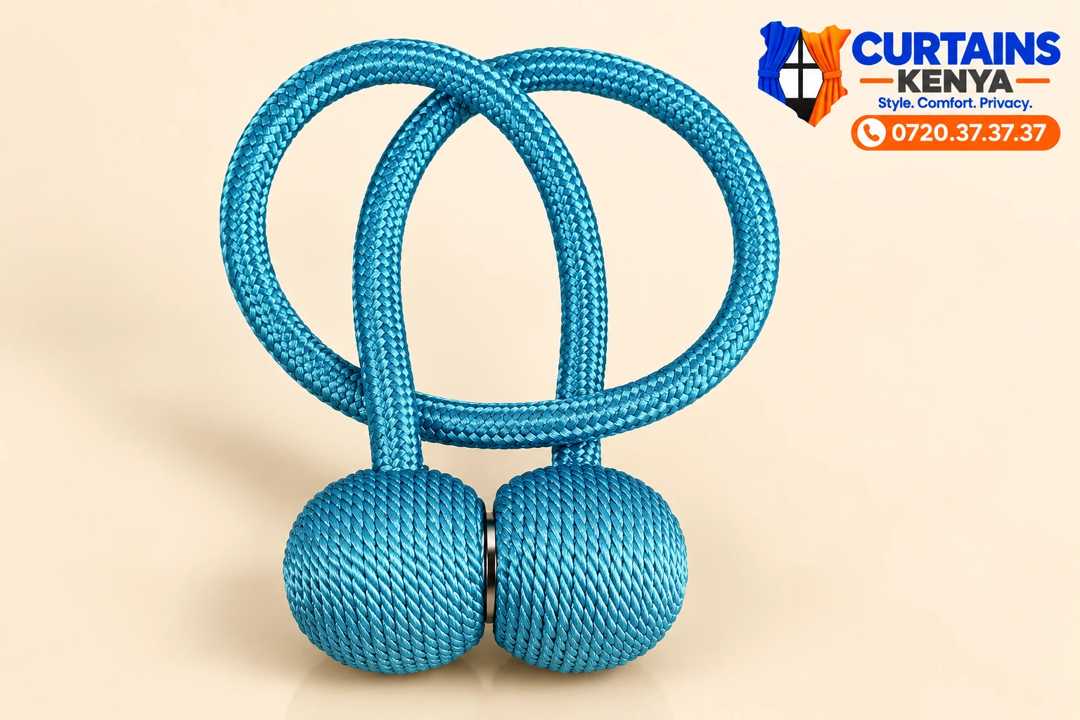 Teal blue magnetic curtain holder with braided cord, round woven ends and a silver-tone clasp.